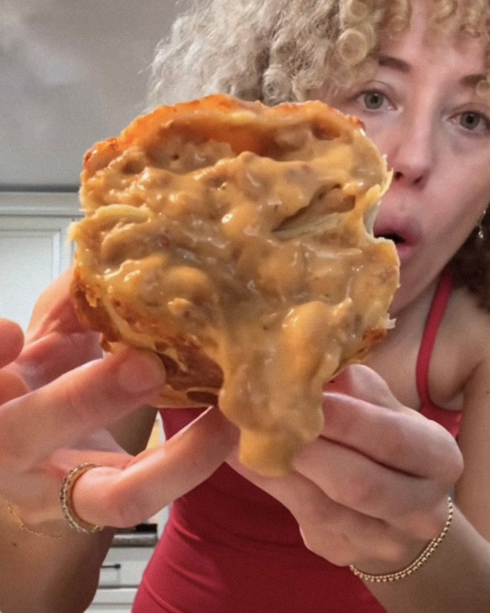 A customer showing the insides of a Bad Hambres burrito for a review