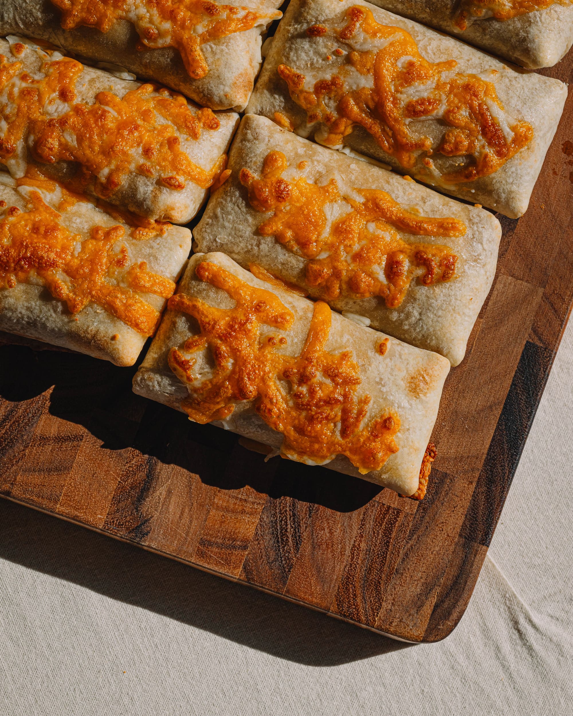 Bad Hambres burritos on a cutting board 